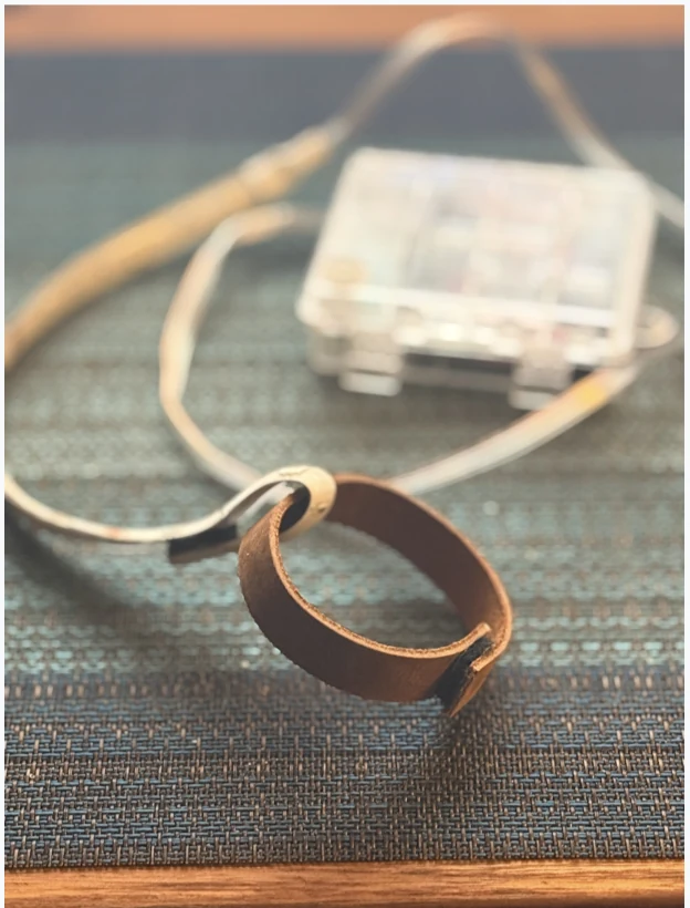 The Wizard-of-Oz band, a leather strap wired to a microcontroller